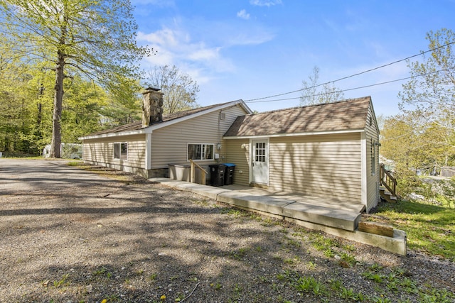 4 Peaceful Way, Windham, ME 04062 - back of property with a chimney