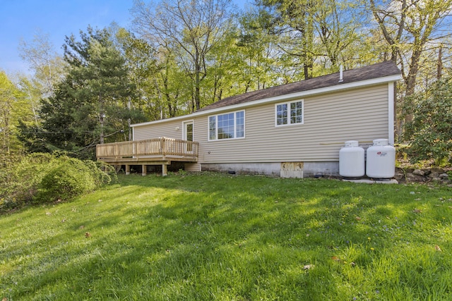 4 Peaceful Way, Windham, ME 04062 - rear view of house with a wooden deck and a yard