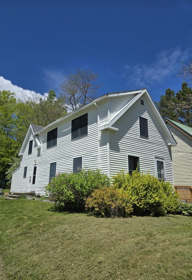 103 Margin St, Orono, ME 04473 - view of property exterior with a yard