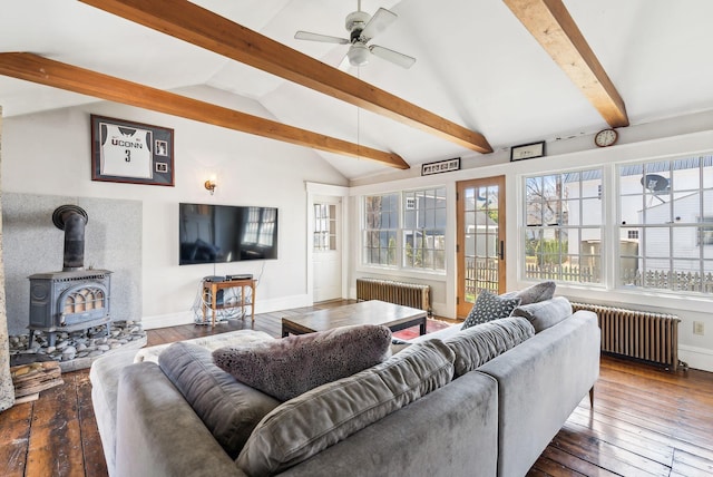 living room featuring radiator, lofted ceiling with beams, and hardwood / wood-style floors