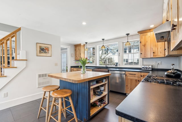 kitchen with a center island, open shelves, wooden counters, a breakfast bar, and dishwasher