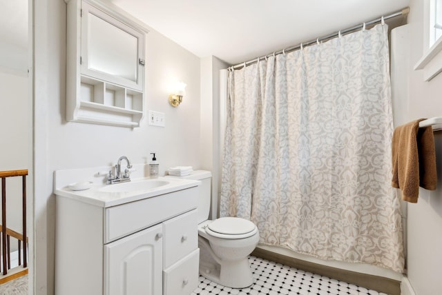 full bath featuring shower / tub combo, toilet, and vanity