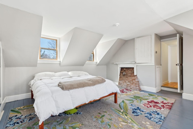 bedroom with baseboards and wood-type flooring