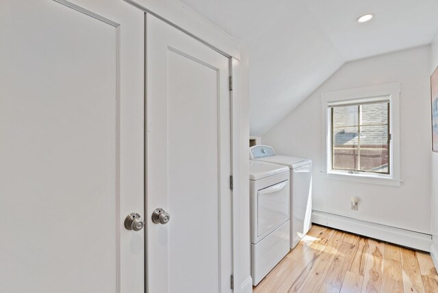 laundry room with recessed lighting, laundry area, a baseboard heating unit, washer and dryer, and light wood-style flooring