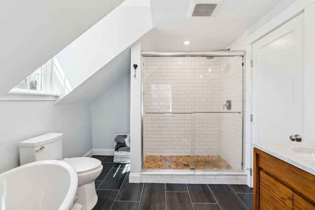 full bath with a stall shower, vanity, toilet, visible vents, and recessed lighting