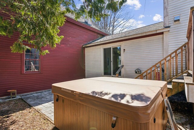 exterior space featuring a hot tub and a patio