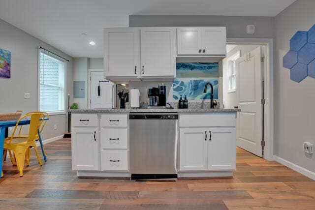 8 College Ave, Gorham, ME 04038 - kitchen featuring stainless steel dishwasher, a sink, baseboards, white cabinetry, and light stone counters