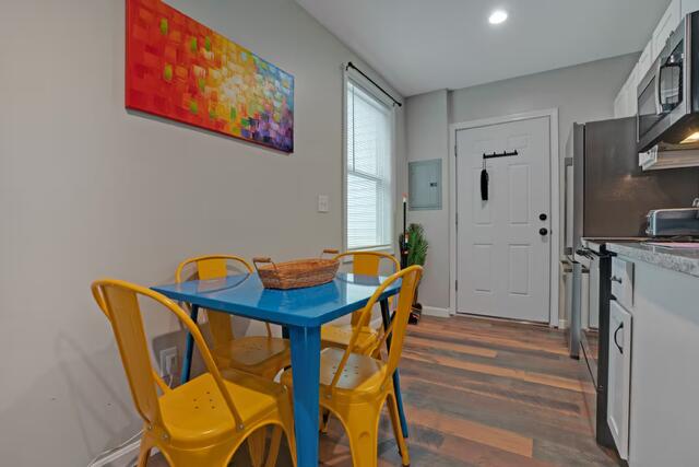 8 College Ave, Gorham, ME 04038 - dining area featuring dark wood-style floors, electric panel, and recessed lighting
