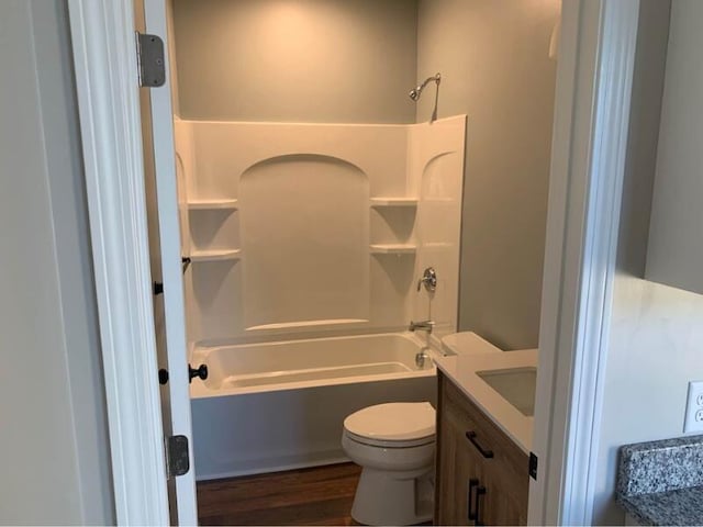 8 College Ave, Gorham, ME 04038 - bathroom with shower / bathtub combination, toilet, vanity, and wood finished floors