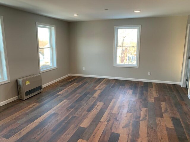 8 College Ave, Gorham, ME 04038 - empty room with dark wood-style flooring, baseboards, recessed lighting, and heating unit