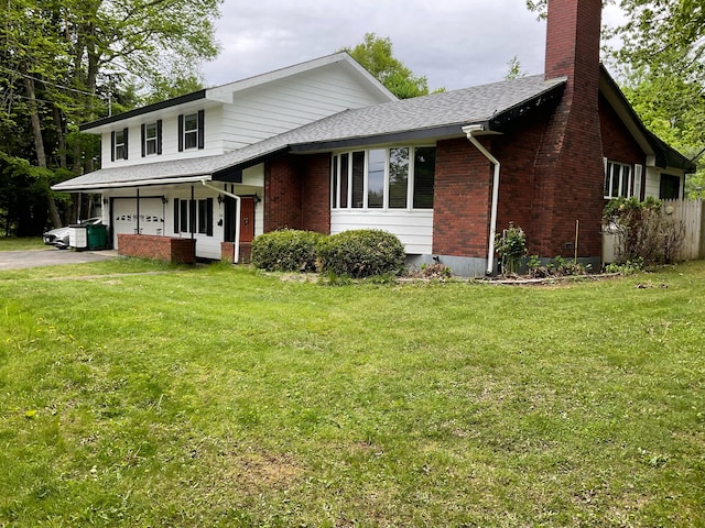 360 Garland Rd, Dexter, ME 04930 - view of front facade featuring a chimney, brick siding, asphalt driveway, an attached garage, and a front lawn