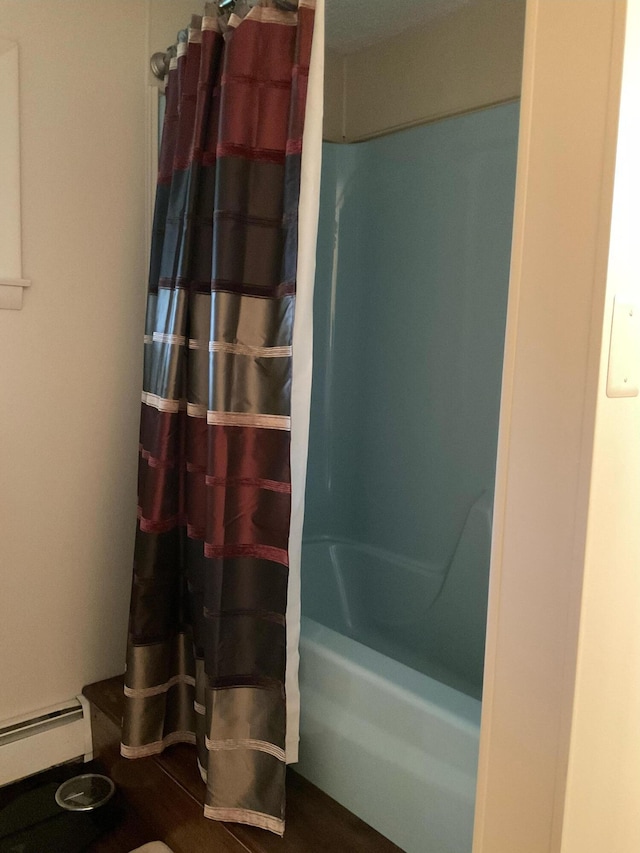 360 Garland Rd, Dexter, ME 04930 - full bathroom featuring baseboard heating and shower / tub combo with curtain