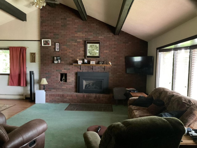 360 Garland Rd, Dexter, ME 04930 - living room with a baseboard radiator, a fireplace, brick wall, and a ceiling fan