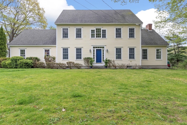 10 Thistleberry Ln, York, ME 03909 - colonial inspired home featuring a chimney, a front yard, and roof with shingles