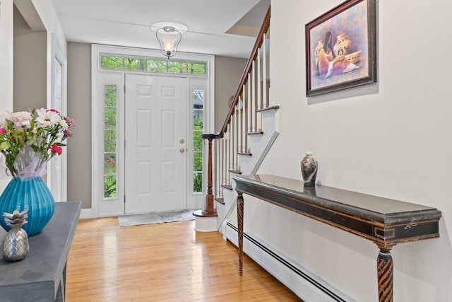 10 Thistleberry Ln, York, ME 03909 - foyer entrance with light wood-style flooring, stairs, and baseboard heating
