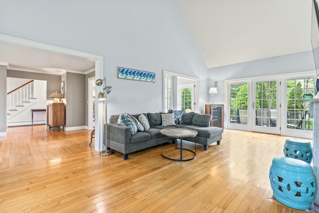 10 Thistleberry Ln, York, ME 03909 - living area with high vaulted ceiling, light wood finished floors, stairway, healthy amount of natural light, and crown molding