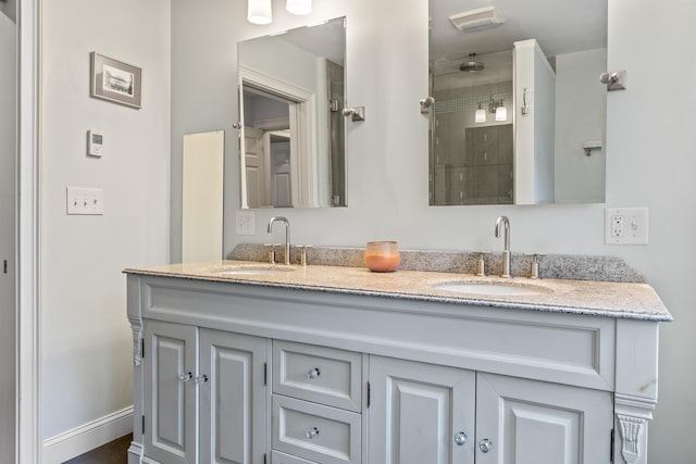 10 Thistleberry Ln, York, ME 03909 - bathroom featuring double vanity and a tile shower