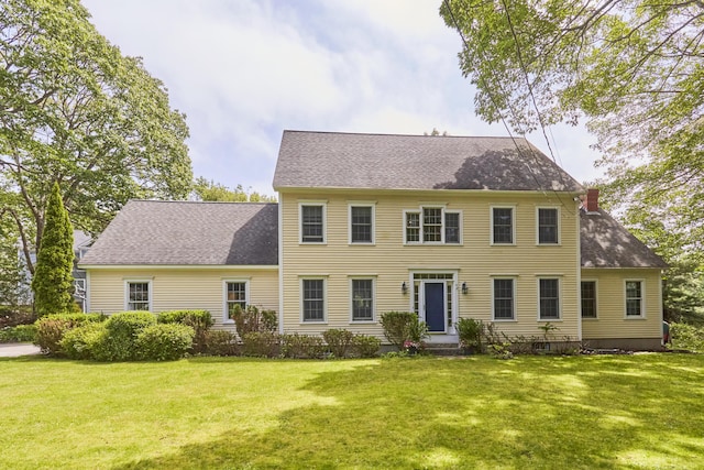 10 Thistleberry Ln, York, ME 03909 - colonial-style house with a front yard, a chimney, and roof with shingles