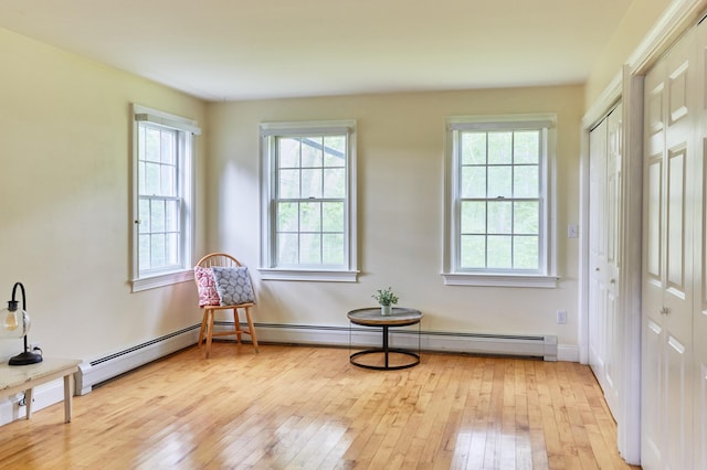 10 Thistleberry Ln, York, ME 03909 - living area featuring light wood finished floors and a baseboard radiator