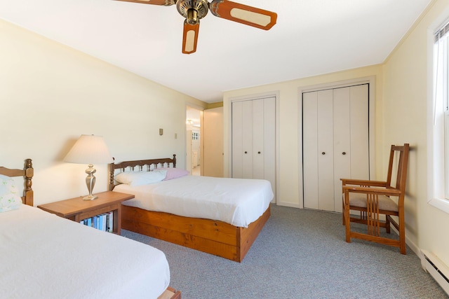 58 Shelton Dr, York, ME 03909 - carpeted bedroom featuring a baseboard heating unit, multiple closets, and a ceiling fan