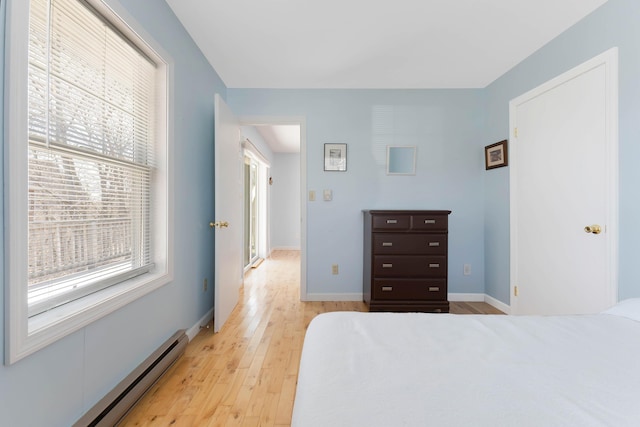 58 Shelton Dr, York, ME 03909 - bedroom with light wood finished floors, baseboard heating, and baseboards
