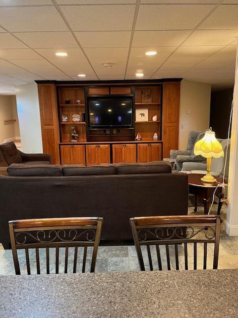 8 Prince St, Lincoln, ME 04457 - living area featuring carpet flooring, a drop ceiling, and recessed lighting