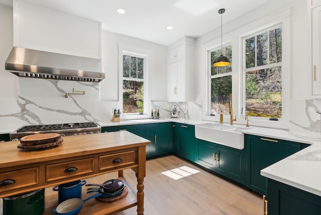 239 Hunter Way, Falmouth, ME 04105 - kitchen featuring green cabinets, wall chimney exhaust hood, a sink, backsplash, and recessed lighting