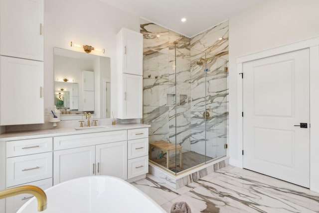 239 Hunter Way, Falmouth, ME 04105 - bathroom featuring marble finish flooring, a marble finish shower, vanity, a freestanding tub, and recessed lighting