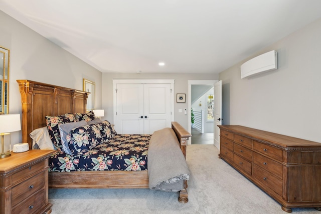 239 Hunter Way, Falmouth, ME 04105 - bedroom with light carpet, a closet, a wall mounted AC, and recessed lighting