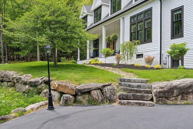 239 Hunter Way, Falmouth, ME 04105 - view of grassy yard with a porch