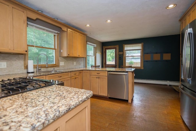 23 Orr St, Wilton, ME 04294 - kitchen featuring stainless steel appliances, a peninsula, recessed lighting, a baseboard radiator, and plenty of natural light