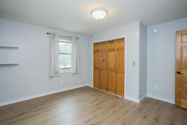 23 Orr St, Wilton, ME 04294 - unfurnished bedroom featuring wood finished floors and a closet
