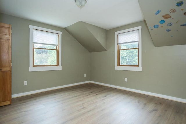 23 Orr St, Wilton, ME 04294 - bonus room with plenty of natural light, wood finished floors, and vaulted ceiling