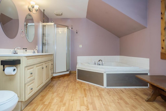 23 Orr St, Wilton, ME 04294 - full bath with vanity, a shower stall, wood finished floors, a garden tub, and lofted ceiling