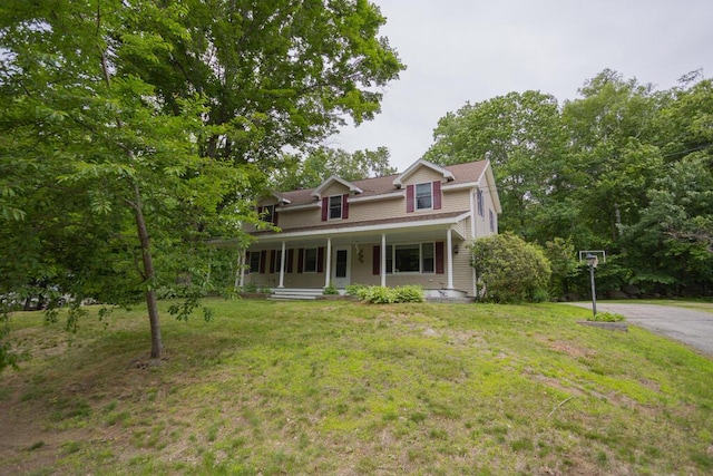 23 Orr St, Wilton, ME 04294 - view of front facade with a porch and a front lawn
