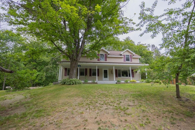 23 Orr St, Wilton, ME 04294 - view of front facade featuring a porch and a front yard