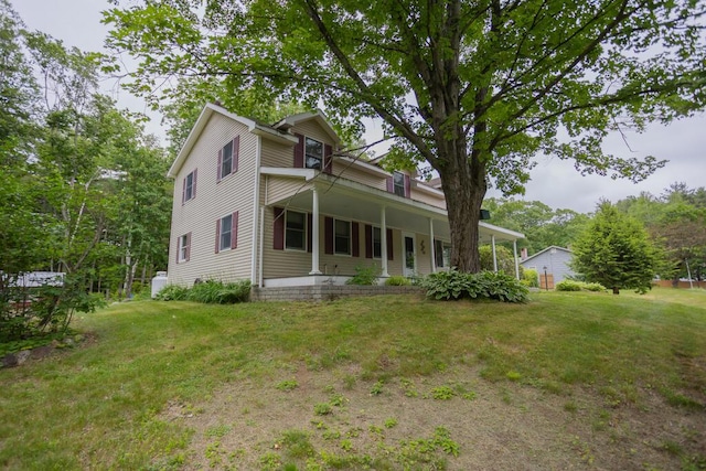 23 Orr St, Wilton, ME 04294 - view of front of house with a front lawn and a porch
