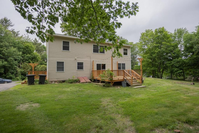 23 Orr St, Wilton, ME 04294 - rear view of house with a lawn and a deck