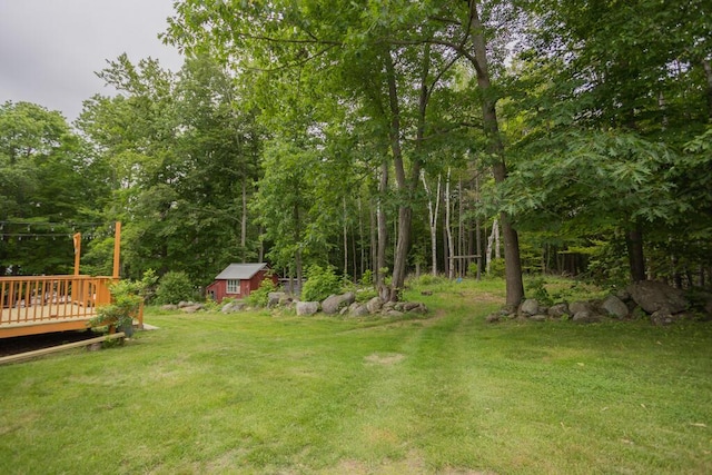 23 Orr St, Wilton, ME 04294 - view of green lawn with a deck and an outdoor structure