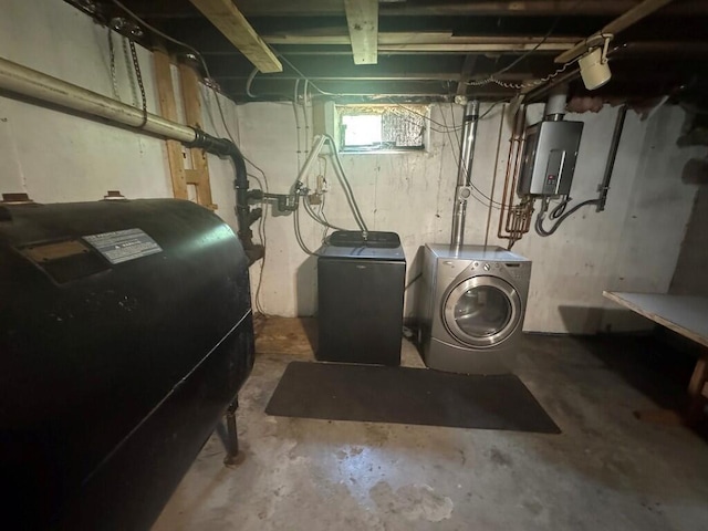 23 Orr St, Wilton, ME 04294 - below grade area with oil tank, water heater, and washer and dryer
