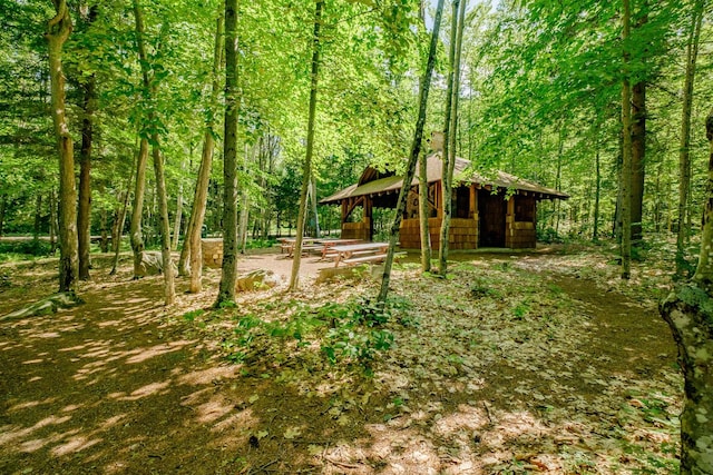 15 Summit Dr, Bridgton, ME 04009 - view of yard featuring a wooded view and an outbuilding