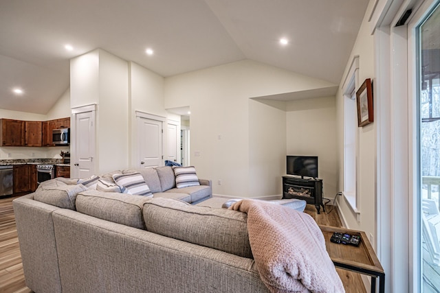 15 Summit Dr, Bridgton, ME 04009 - living room featuring light wood-type flooring, vaulted ceiling, and recessed lighting