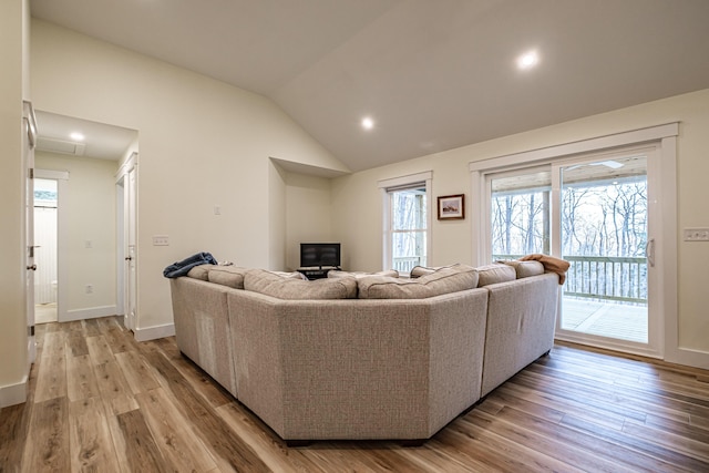 15 Summit Dr, Bridgton, ME 04009 - living area featuring light wood-style floors, recessed lighting, vaulted ceiling, and a wealth of natural light