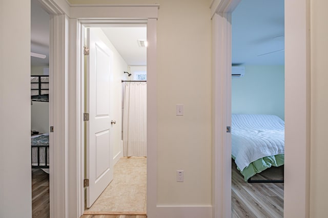 15 Summit Dr, Bridgton, ME 04009 - hallway with visible vents, light wood-type flooring, and a wall unit AC