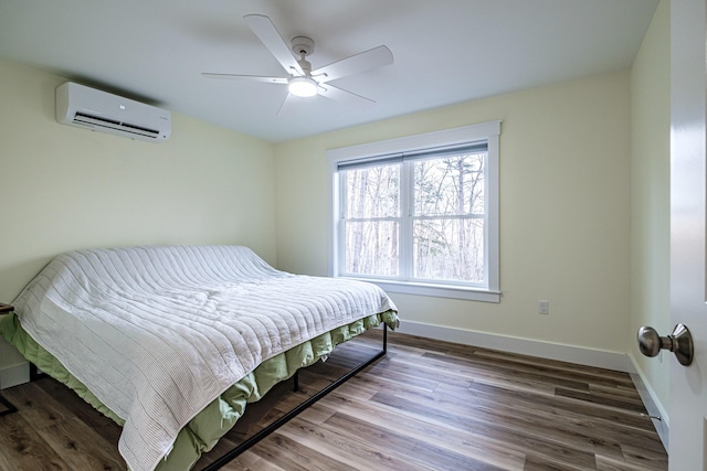 15 Summit Dr, Bridgton, ME 04009 - bedroom with ceiling fan, an AC wall unit, baseboards, and wood finished floors