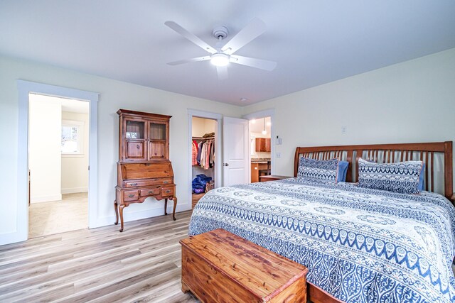 15 Summit Dr, Bridgton, ME 04009 - bedroom with a closet, baseboards, a walk in closet, ceiling fan, and light wood finished floors