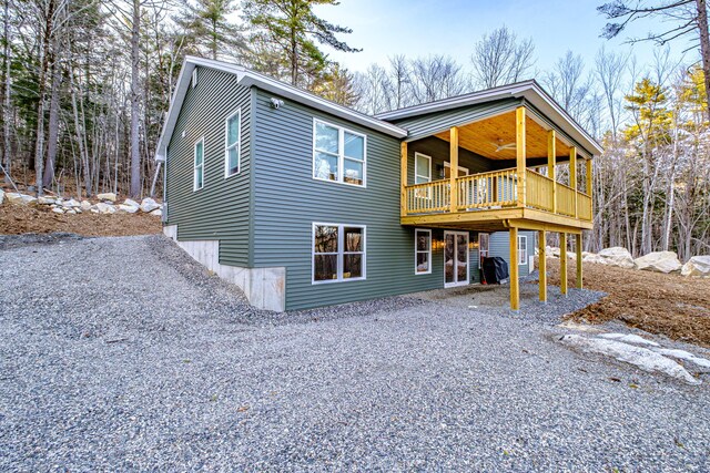 15 Summit Dr, Bridgton, ME 04009 - rear view of house with a ceiling fan, a wooden deck, and gravel driveway