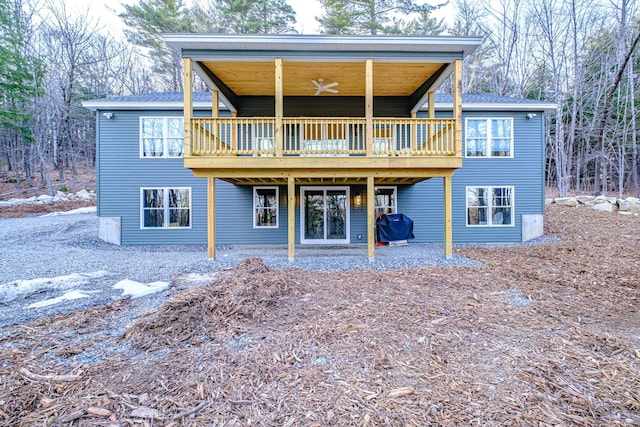 15 Summit Dr, Bridgton, ME 04009 - back of property featuring roof with shingles and a wooden deck