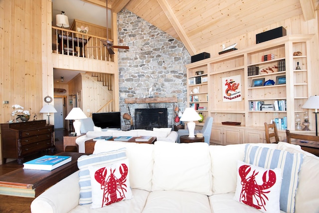 living room with wood ceiling, a fireplace, high vaulted ceiling, and beam ceiling