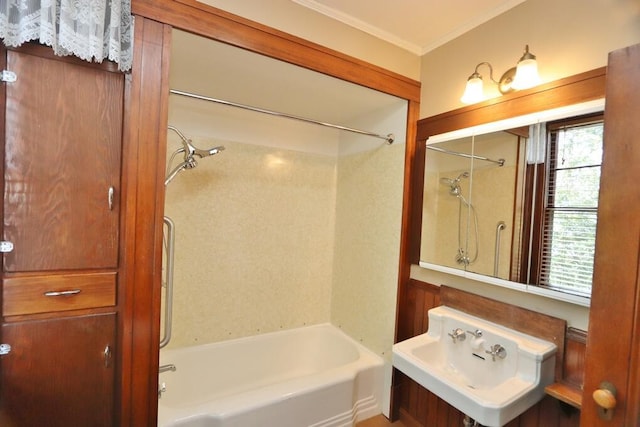 full bathroom with ornamental molding, shower / tub combination, and a sink